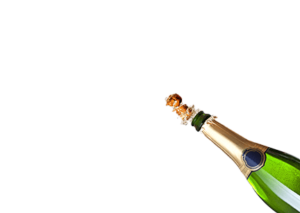 Champagne bottle popping on a white background